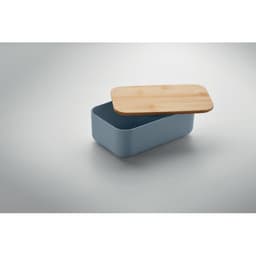 A blue food storage container with a wooden lid, partially open, showcasing the inside.