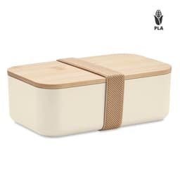 A cream-coloured lunch box with a wood lid, secured with a beige strap and featuring a logo.