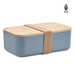A lunch box with a blue base, a wooden lid, and a mesh strap for secure closure. It features a logo on the side.