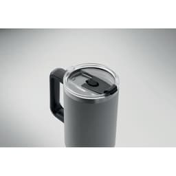 A drink bottle in dark grey with a stainless steel lid and a black handle, featuring a transparent opening.