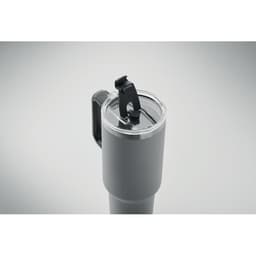 A drink bottle in matte grey with a clear lid and a black silicone strap for easy handling.