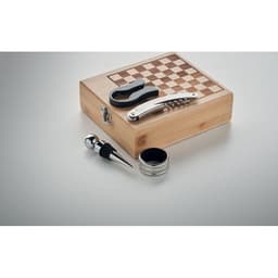 A wooden chess set box with a checkerboard design, containing a corkscrew, bottle stopper, and a knife.