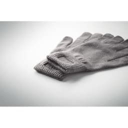 A pair of grey gloves folded neatly on a light background, featuring ribbed cuffs.