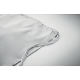 A grey fabric product with a soft texture and a white cord. It features a small logo tag on one side.
