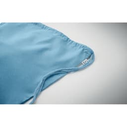 A light blue fabric item with a gathered edge. It features a small tag on one side.