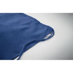 A blue fabric bag with a gathered top and a tag on the side, featuring a smooth texture.
