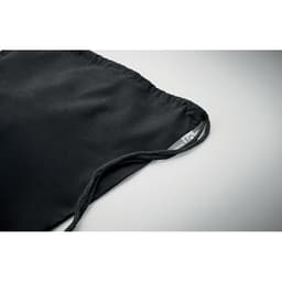 A black drawstring pouch with a textured fabric and two cords on either side for closure.