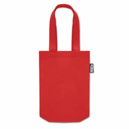 A red tote bag with two handles and a small branding tag on one side.