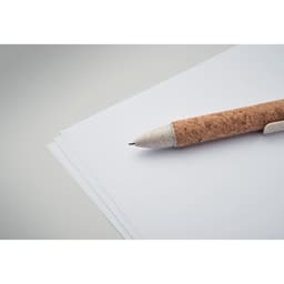A cork-handled pen rests on a stack of blank white paper, showcasing a minimalist stationery setup.