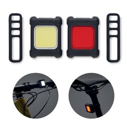 A set of two bicycle lights, one yellow and one red, with black rubber mounts for attachment.