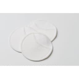 Three round, white cotton pads are displayed on a light background.