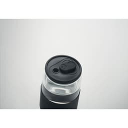 A drink bottle with a transparent upper section and a black lower section, featuring a black lid and spout.