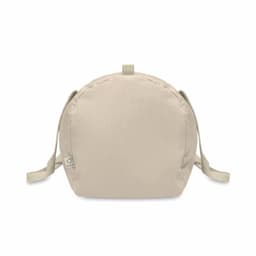 A beige bag with two straps and a rounded design, featuring a small logo on the side.