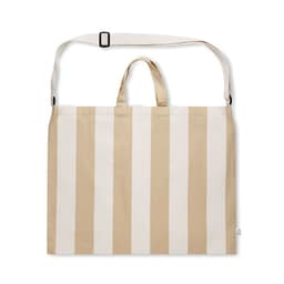 A tote bag with beige and white vertical stripes, featuring handles and an adjustable strap. It has a logo.