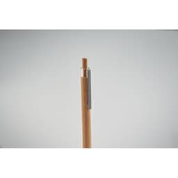 A pen with a wooden barrel and silver clip, featuring a minimalist design against a light background.