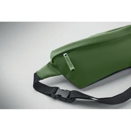 A green waist bag with a black strap and zip closure, featuring a simple design and a logo.