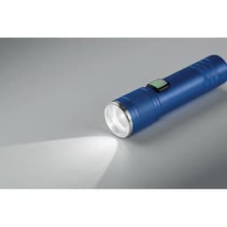 A blue flashlight with a textured grip, featuring a button for activation, casting a beam of light.