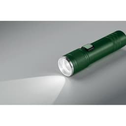 A green flashlight with a textured grip and a silver reflector, casting a beam of light. It features a power button.