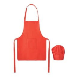 A red kids' apron with a front pocket and a matching chef hat, featuring a logo.