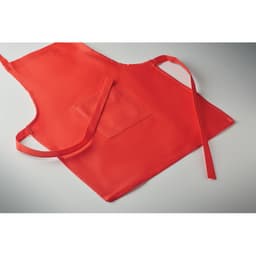 A red children's apron featuring a front pocket and long ties for fastening. It has a simple design without logos.
