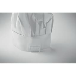 A white chef hat with a pleated design, featuring a blank area for personalisation.