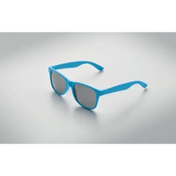 A pair of blue sunglasses with grey lenses, displayed on a smooth surface. The glasses have a modern frame design.
