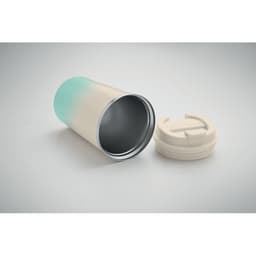 A drink bottle with a gradient from light blue to cream, featuring a removable white lid and a sleek design.