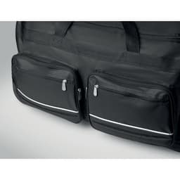 A black duffel bag featuring two zippered front pockets and sturdy carrying handles.