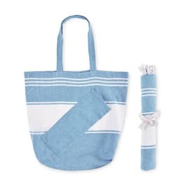 A blue striped tote bag with two long handles, accompanied by a rolled-up towel tied with a ribbon.