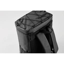 A black insulated cooler bag with a rounded top and exterior bungee cords for extra storage. Features shoulder straps.