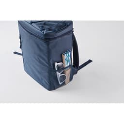 A navy blue backpack with a mesh side pocket containing books and a pair of glasses. It features a logo.