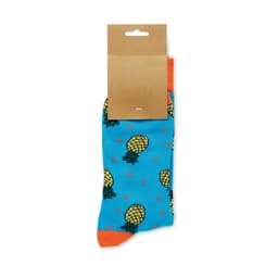 A pair of blue socks featuring pineapple designs and orange accents, packaged with a card label.