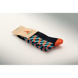 A pair of multicoloured socks featuring a geometric pattern, predominantly black with orange and turquoise accents.