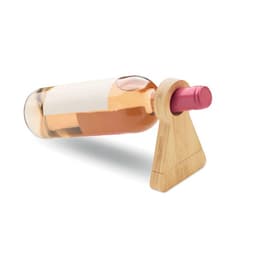A drink bottle holder made of bamboo, supporting a pink-capped wine bottle filled with rosé.