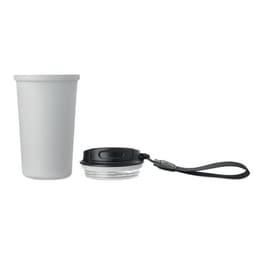 A drink bottle with a black lid and wrist strap next to a white cup. The lid has a logo.