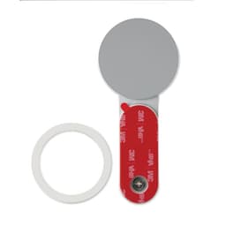 A round, silver adhesive mirror with a red and white backing strip featuring a logo.