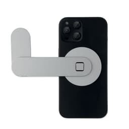 A mobile phone with a grey attachment mounted on the back, featuring a circular design and a lever-like arm.