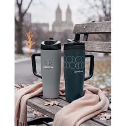A drink bottle duo in grey and dark green with handles, placed on a park bench. Both feature a logo.