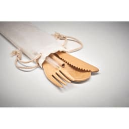A set of wooden utensils including a fork, knife, and spoon, placed inside a drawstring fabric pouch.