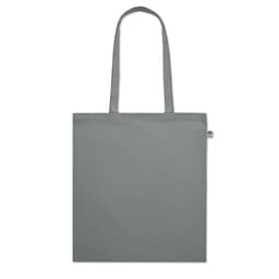 A grey tote bag with long handles and a small tag on the side, featuring a minimalist design.