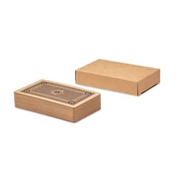 A wooden box with an intricate design on top, alongside a plain cardboard box. Both boxes are rectangular in shape.