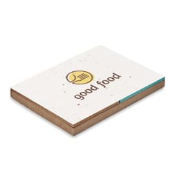A square notebook with a beige cover featuring a logo and the words "good food" in brown.
