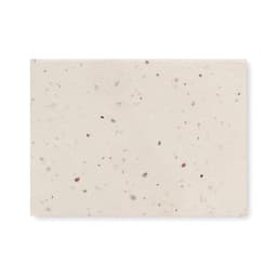 A rectangular slab of light beige material with speckles of darker colours throughout. It has a smooth surface and edges.