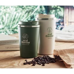 Two insulated drink bottles in green and white, placed on a wooden surface with coffee beans scattered nearby.
