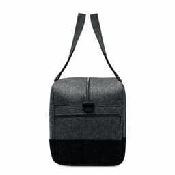 A dark grey and black Indico Bag with a zippered closure and an adjustable shoulder strap.