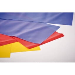 A collection of flat, flexible sheets in blue, red, yellow, and purple, stacked together on a light background.
