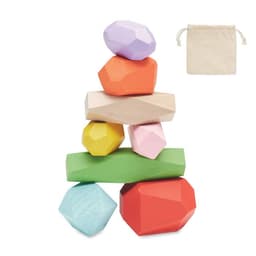 A stack of colourful geometric blocks in various shapes, alongside a small beige fabric storage bag.