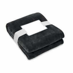 A folded soft black blanket, neatly packaged with a white band around it and a blank label.