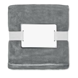 A grey blanket neatly folded and secured with a white band. It has a blank label on the front.
