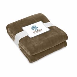 A folded brown blanket secured with a white band, featuring a logo on the packaging.